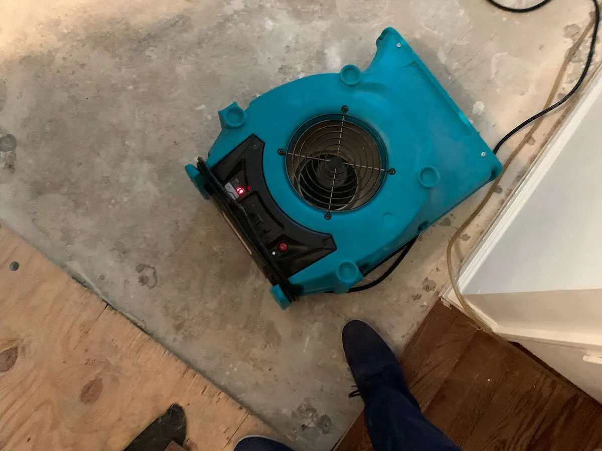 Air mover drying subfloor during Leak Detection & Repair in Roswell